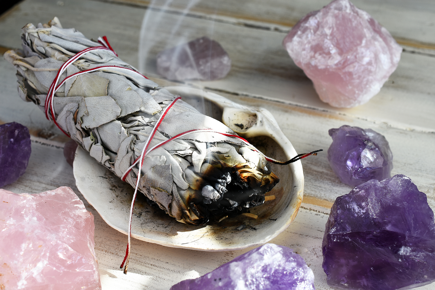 white sage smudge stick with healing stones