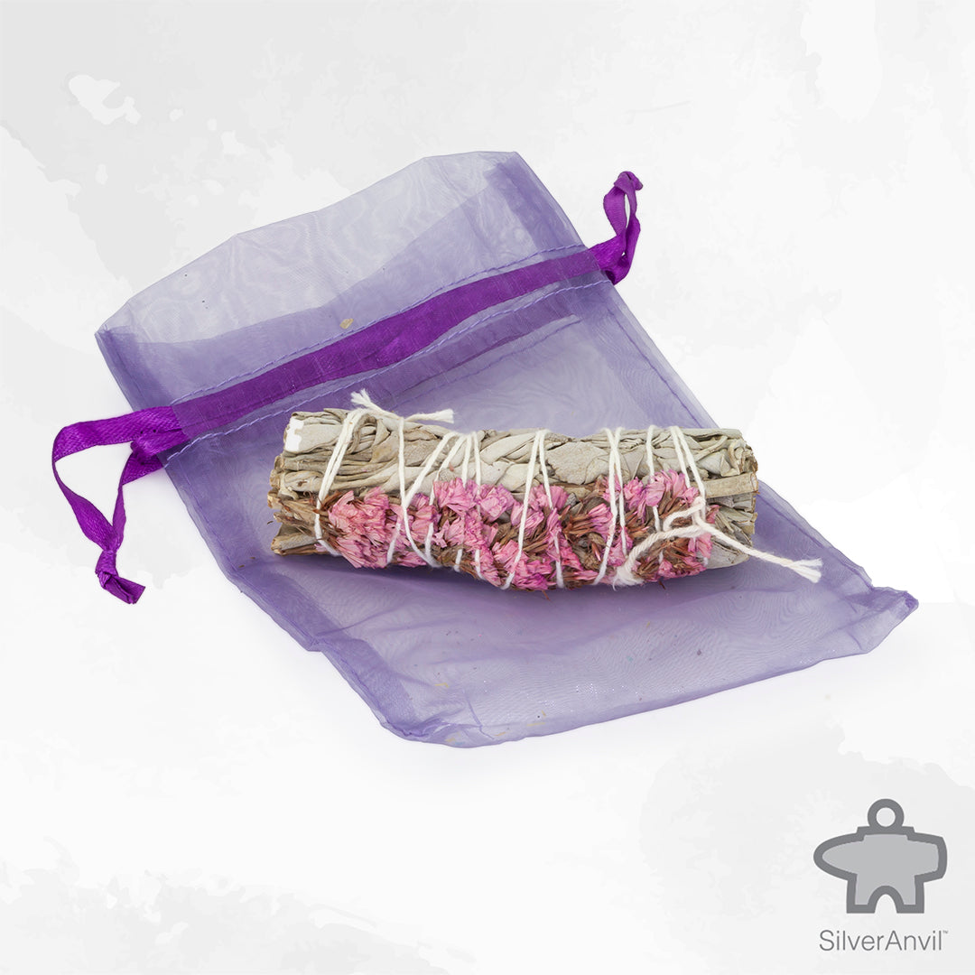 White sage smudge stick with pink sinuata flowers for cleansing with storage bag